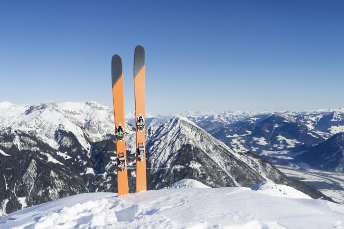 Skis in snow against sky