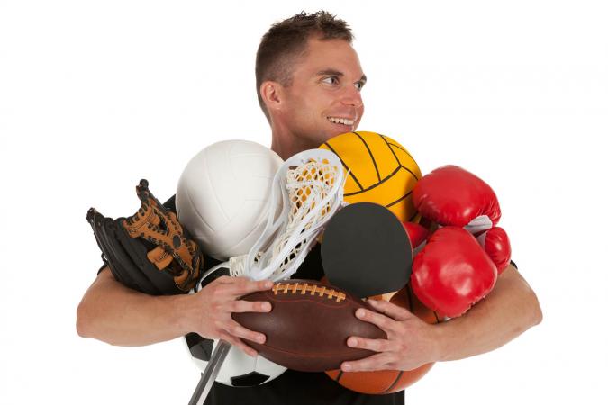 Man holding sports equipments