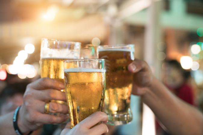 Toasting with beer glasses