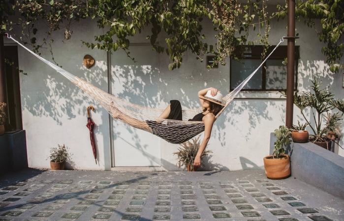 Woman Relaxing In Hammock