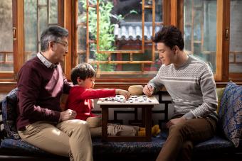 Chinese family playing the game of go