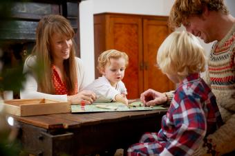 family playing board game Monopoly