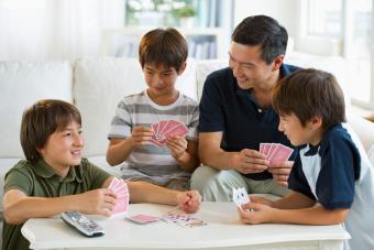 Father and sons playing Go Fish