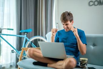 Man playing a online game on laptop