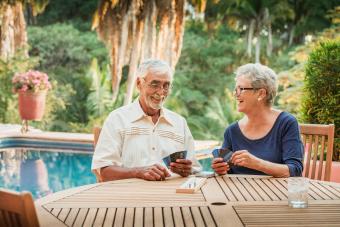 Senior Couple playing cribbage outdoors