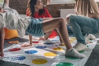 group of friends playing strip twister