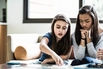 girls playing board game