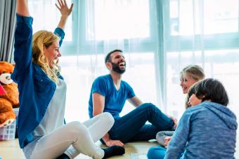 family playing board game