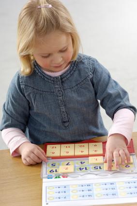 Girl playing math game