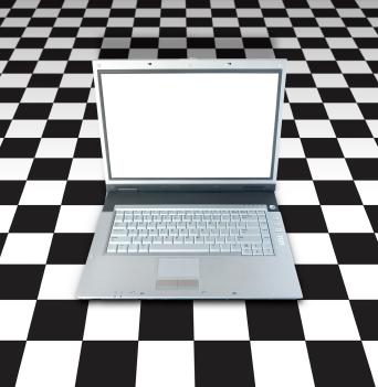 Laptop on a checkerboard