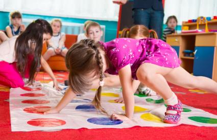 Toddlers playing Twister