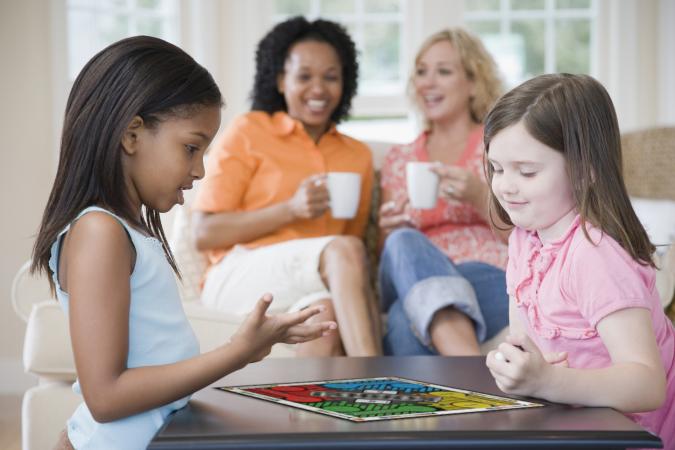 girls playing a board game