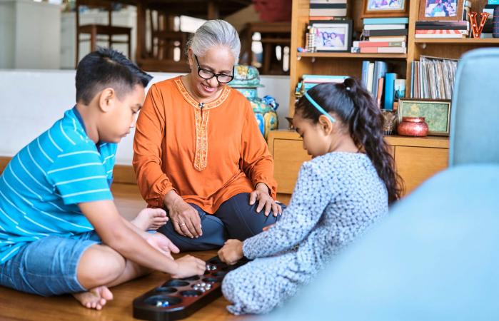 Kids playing Mancala board game