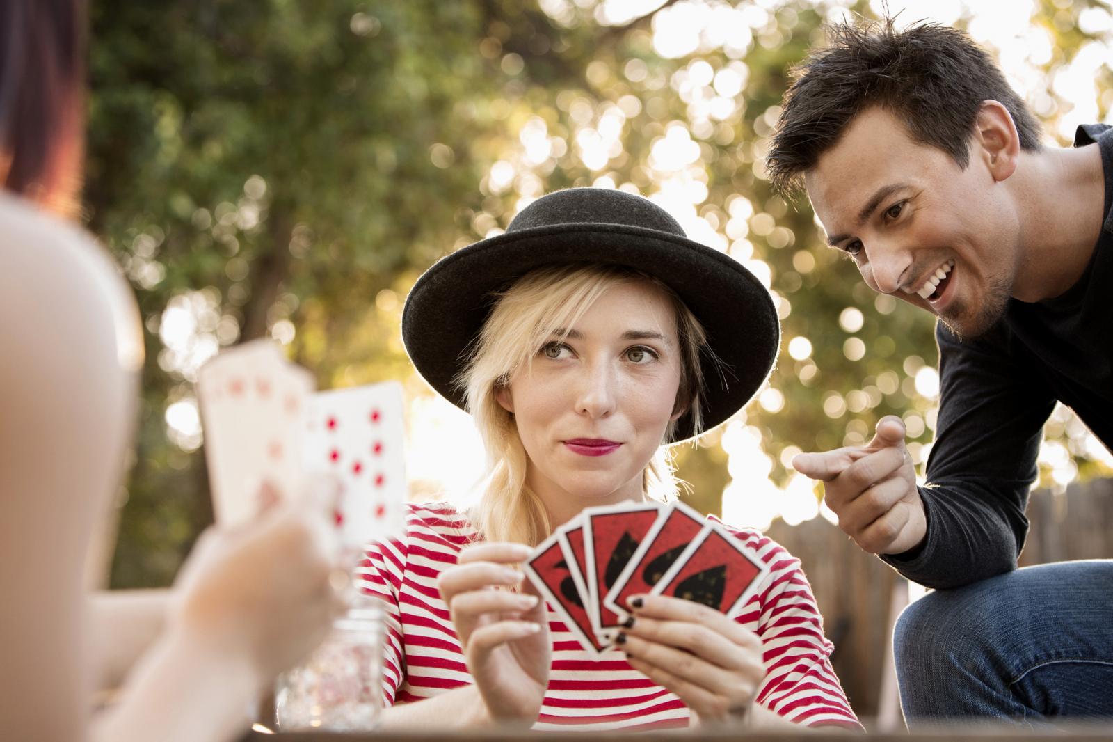 Friends playing card game in the park