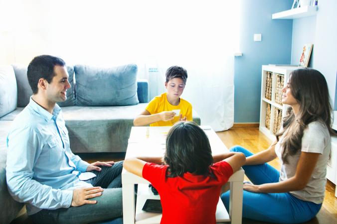 Family playing board game