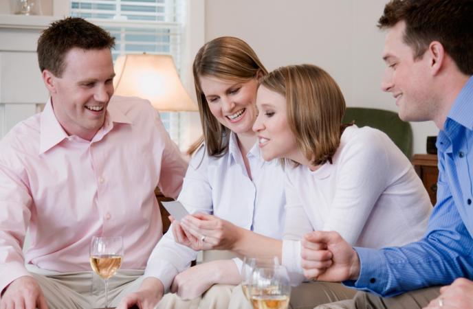 four friends playing board game