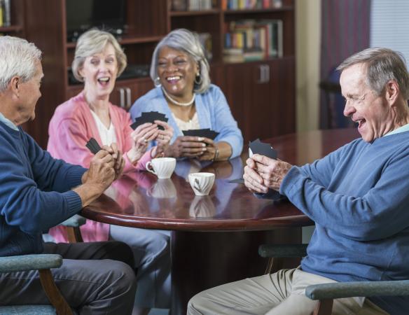 group of seniors playing card game
