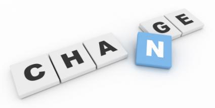 the word "change" spelled in letter tiles