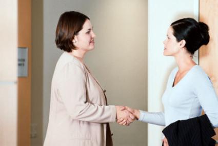 businesswomen shaking hands