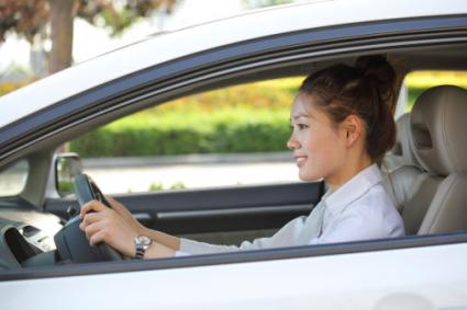 Business woman driving a car