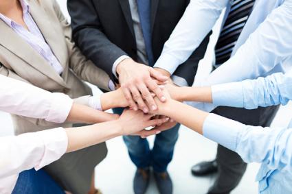 hands-in businesspeople
