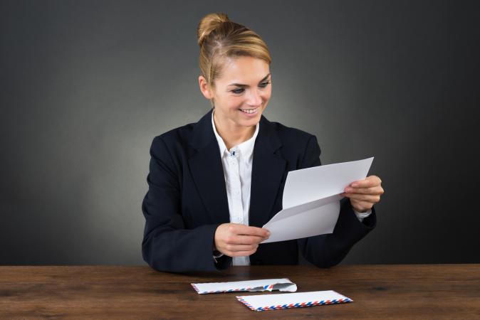 woman reading business letter