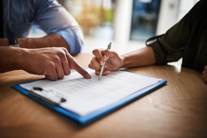 Man and woman completing paperwork