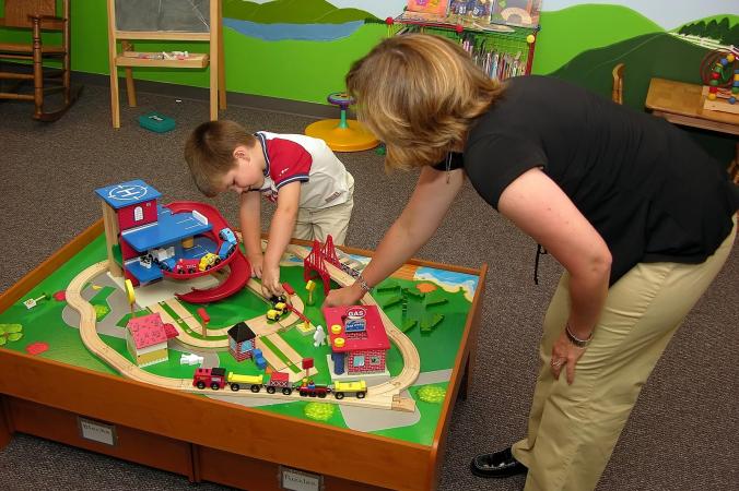 Preschool teacher with student