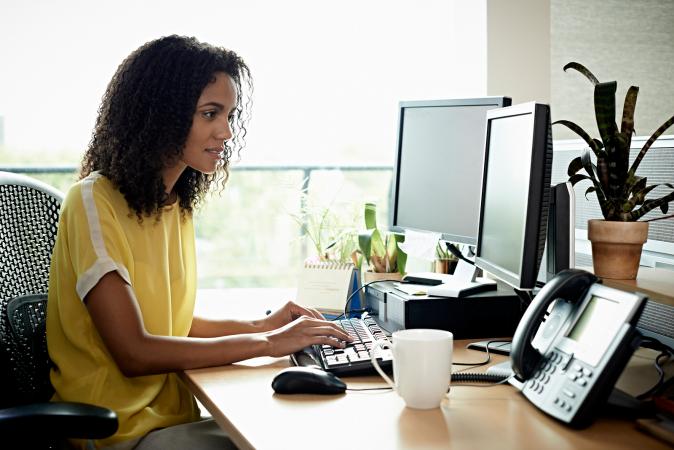 Business woman typing transmittal letter