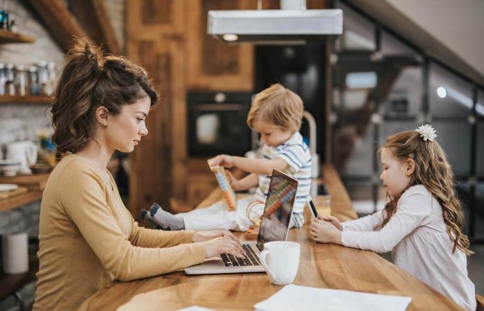 mother with two kids working from home