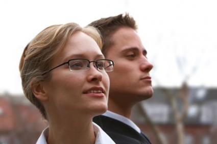 Two young corporate office workers