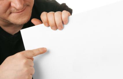Man holding blank paper for business flyer