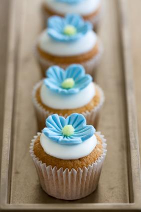 Cupcakes with blue fondant flowers
