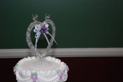 A heart-shaped wedding cake topper