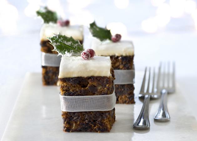 Squares of Christmas cake adorned with a cranberry