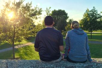 Family enjoying the view at sunset while camping on Labor Day