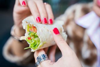Woman eating a wrap