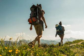 Young couple hiking on mountain trail