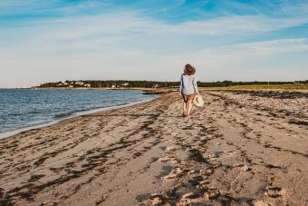 woman walking on Cape Cod beach