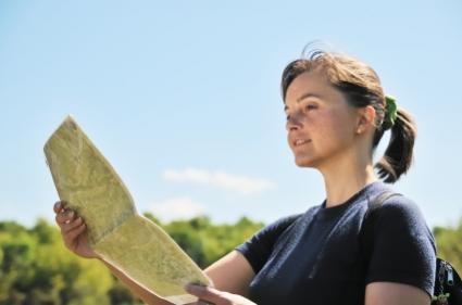 Backpacker checking her map