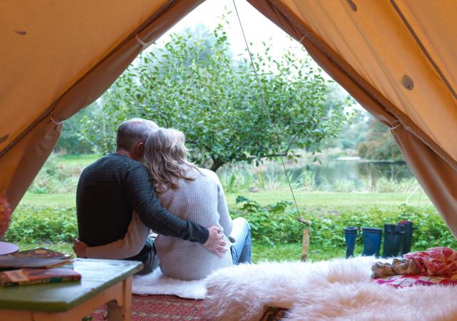Couple sitting in luxury tent