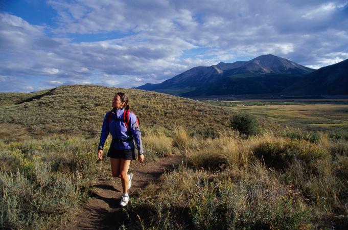 Young woman hiking on trail