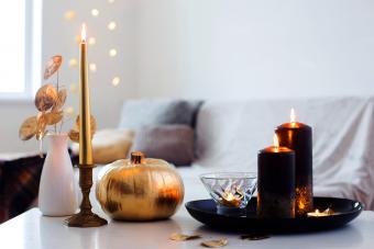 Home decor with golden burning candles
