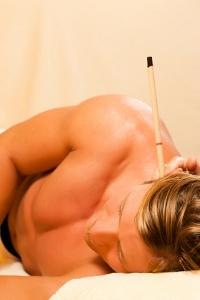 Man receiving ear candling