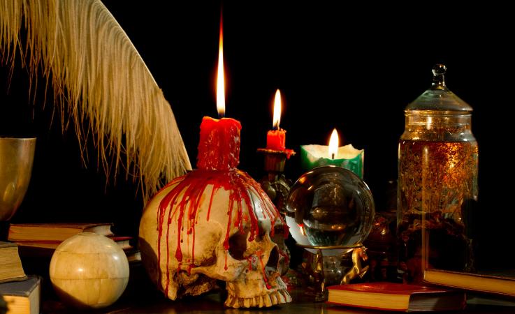 skull candle holder on desk