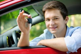 Young man with car key