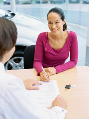 Woman considering a car document