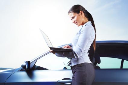woman with car and computer