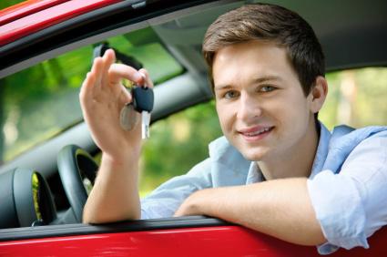 Young man with car key