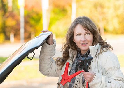 woman with jumper cables
